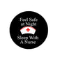 Black round pinback button, 'Feel Safe at Night' text and nurse icon with red cross