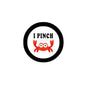 1.25-inch pinback button with black ring, white center, 'I PINCH' text and red crab