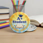 2.25-inch round student pinback button with A+ Student text, book and graduation cap