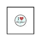 Round pinback button with black rim, 'I ♥ this place!' and red heart