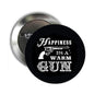 Round black pinback badge with white slogan and small gun graphic, silver safety pin back