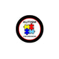 Round autism awareness pinback button with puzzle pieces and "Autism Awareness" text