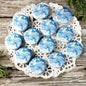 Blue smile pinback button pins with white smiling face logo, multiple round badges