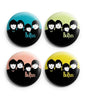 The Beatles pinback button set (4) with round portrait designs on black backgrounds