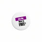 Round pinback badge: “Ask Me What is FREE?” text in purple and black, white center