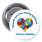 Autism pinback button: white circle with heart puzzle pieces and I have Autism text