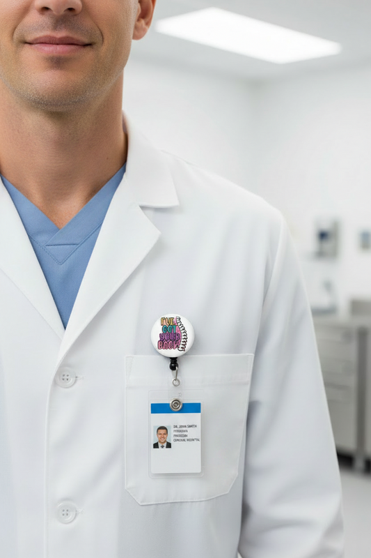 White lab coat with retractable badge reel clipped to chest pocket