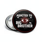 2.25-inch round button pinback with black face, red border, bold text and eye graphic