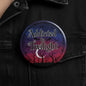 Round purple pinback button with “Addicted to Twilight” text and tree silhouettes