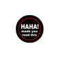 Black pinback button with red circle, "HAHA!" and "made you read this" text