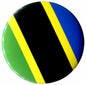 Circular Tanzania flag enamel pin with diagonal black, yellow, blue, and green stripes