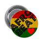 2.25-inch round pinback button with red, yellow, and green abstract text and a heart