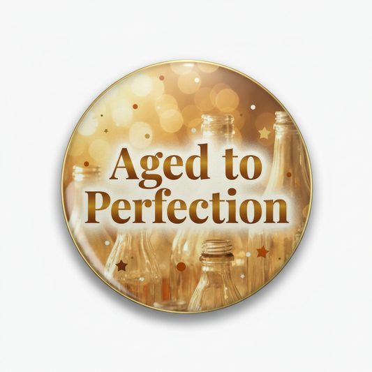 Round birthday pinback button with “Aged to Perfection” text and gold party theme