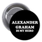 2.25-inch black pinback button with white "ALEXANDER GRAHAM IS MY HERO" text