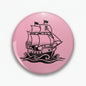 2.25-inch pink and black pirate ship pinback button with sailing ship graphic