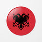 Albania flag circular keychain with black double-headed eagle on red background