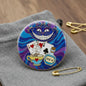 Round enamel pinback button with Cheshire Cat artwork, gold rim, 2.25-inch