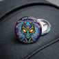 2.25-inch alien pinback button, colorful cartoon face, round with silver backing