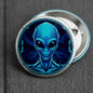 Blue alien face pinback button with silver rim and safety clasp, 2.25-inch