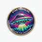 Round pinback button with colorful alien spaceship graphic and Star Traveler text