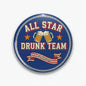 Round blue pinback button with beer mugs and stars, reading 'ALL STAR DRUNK TEAM'