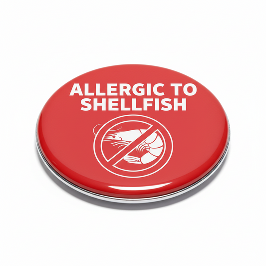 Red pinback button: 'ALLERGIC TO SHELLFISH' with crossed shellfish icon
