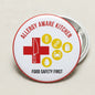 Round red-and-white kitchen allergy safety pinback badge with utensil and icons
