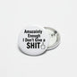 2.25-inch pinback button with white face, black text, and pointing hand icon