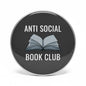 Round black pinback button with white 'ANTI SOCIAL BOOK CLUB' and open book icon