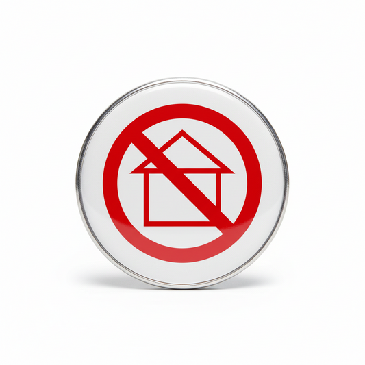Round metal pinback button with red no-symbol circle and slash