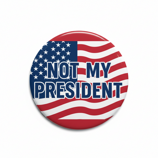 Patriotic pinback button: circular US flag with bold “NOT MY PRESIDENT” lettering