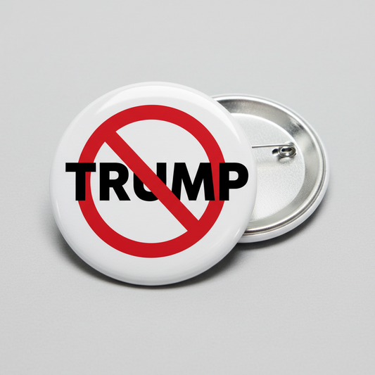Anti-Trump pinback button (2.25 in), white with red slash over TRUMP text
