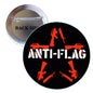 Round pin badge, black and orange anti-flag graphic, 2.25-inch