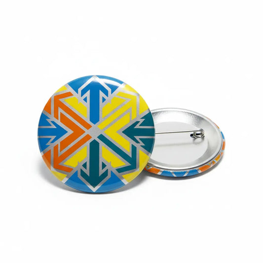 Two round buttons with a colorful arrow pattern, one face up and one face down showing the pin