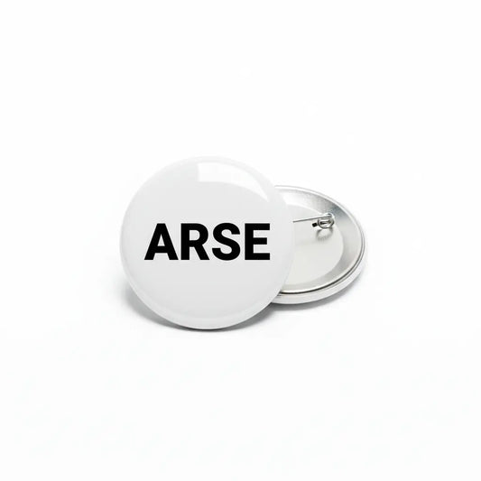 White button badge with the word ARSE in black capital letters