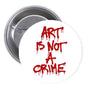 1.25-inch pinback button: red graffiti 'ART IS NOT A CRIME' on white