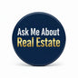 Round dark-blue lapel pin with gold/white text: “Ask Me About Real Estate”.