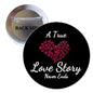 1.25-inch round pinback button, black with pink heart and white "A True Love Story" text