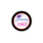Round pinback button with black edge and white center, purple cupcake and 'Fabulous since 1962'