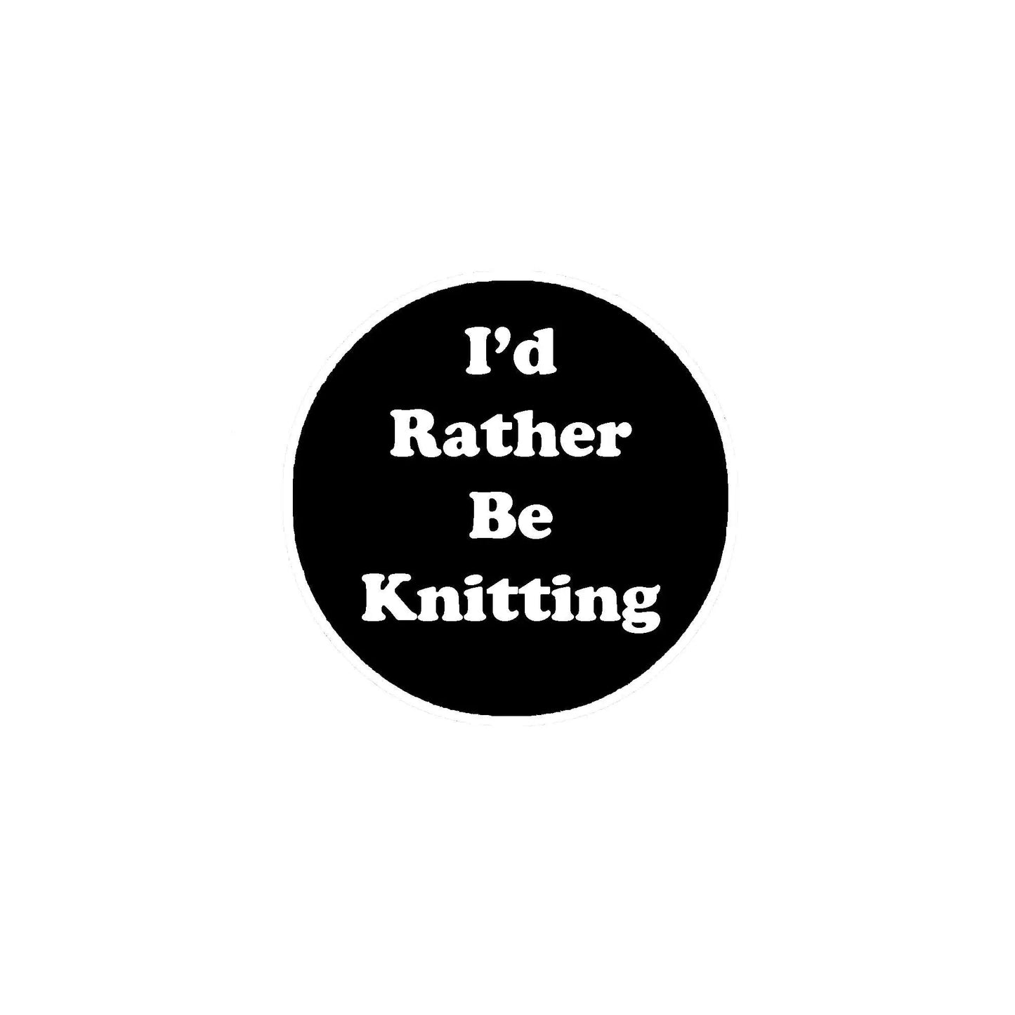 Round black pinback button with white 'I'd Rather Be Knitting' text