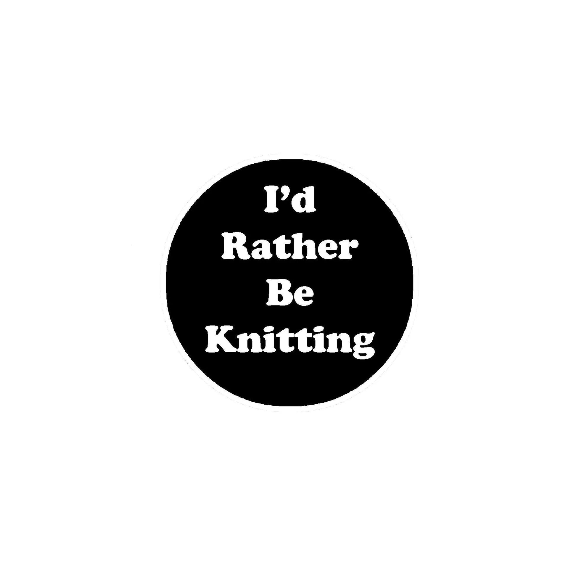 Round black pinback button with white 'I'd Rather Be Knitting' text