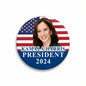 Round pinback button with portrait, U.S. flag, and “Kamala Harris President 2024”