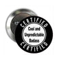 Round pinback button brooch, black face with 'CERTIFIED' and 'Cool and Unpredictable Badass'