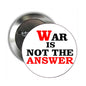 2.25-inch circular pinback badge with clasp; text reads “WAR IS NOT THE ANSWER”