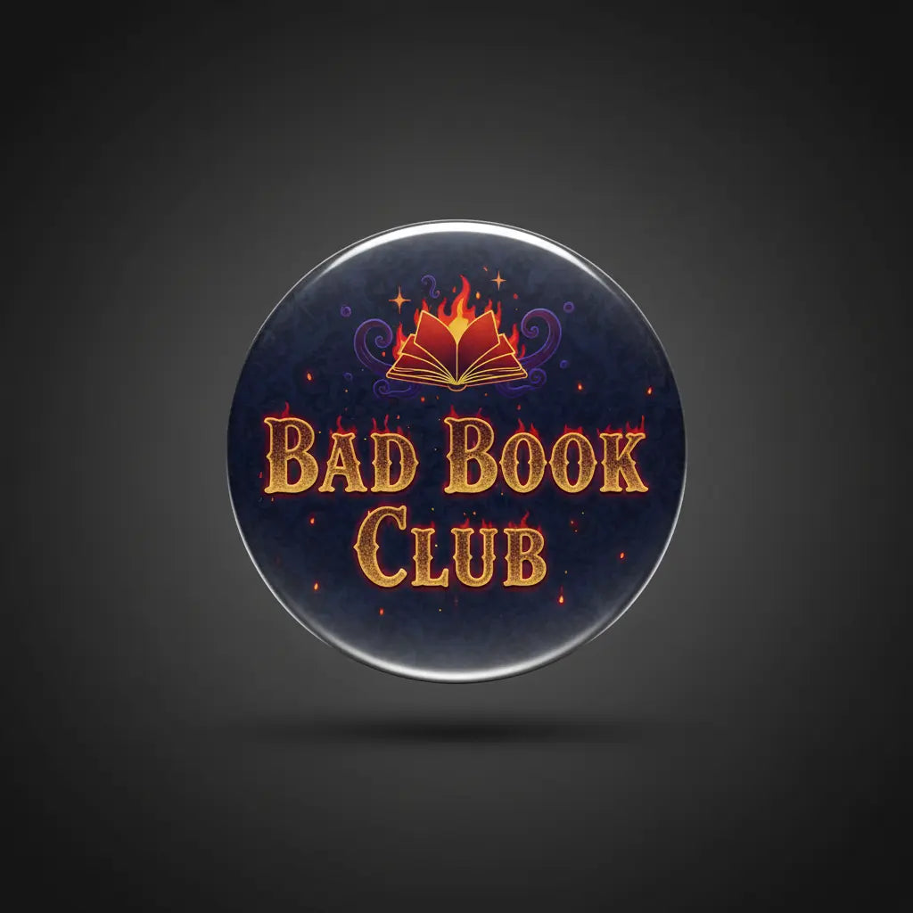 Round navy pinback button with open-book icon and orange “BAD BOOK CLUB” text