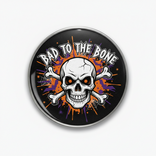 Halloween pinback button with black background, skull face, “Bad to the Bone” text, orange glow
