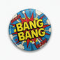 Round comic pinback button with bold “BANG BANG” text, blue burst and comic speech bubbles
