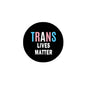 Round pinback badge brooch with black face and “TRANS LIVES MATTER” text