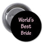 Round black bride pinback badge with pink script “World's Best Bride”