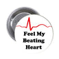 Feel My Beating Heart pinback button with red heartbeat line and black text